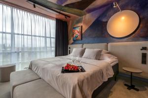 Postel nebo postele na pokoji v ubytování Art Hotel Pallas by Tartuhotels