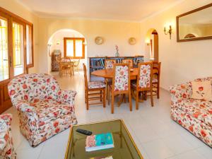 a living room with a table and chairs at Holiday Home Amarilla by Interhome in Pedramala