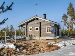 a small house in the snow with at Holiday Home Inarinlahti by Interhome in Inari