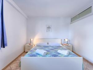Posteľ alebo postele v izbe v ubytovaní Apartment Nika-4 by Interhome