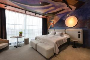 Postel nebo postele na pokoji v ubytování Art Hotel Pallas by Tartuhotels