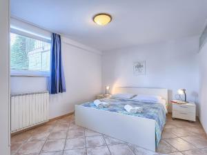 Posteľ alebo postele v izbe v ubytovaní Apartment Nika-4 by Interhome