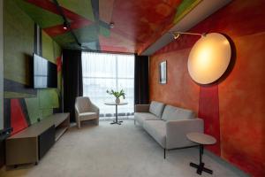 TV a/nebo společenská místnost v ubytování Art Hotel Pallas by Tartuhotels