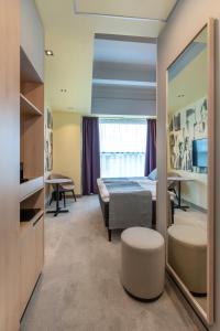 TV a/nebo společenská místnost v ubytování Art Hotel Pallas by Tartuhotels