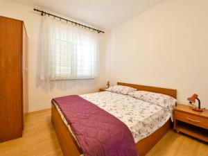 Postel nebo postele na pokoji v ubytování Holiday Home Mia by Interhome