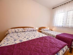 Postel nebo postele na pokoji v ubytování Holiday Home Mia by Interhome