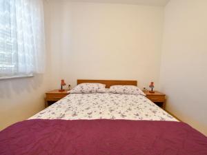 Postel nebo postele na pokoji v ubytování Holiday Home Mia by Interhome