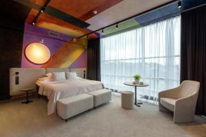 Postel nebo postele na pokoji v ubytování Art Hotel Pallas by Tartuhotels