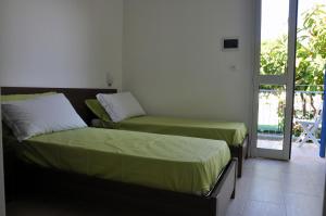 Een bed of bedden in een kamer bij Villa Lara