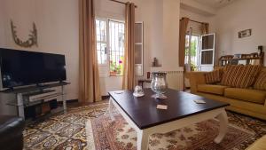 Telewizja i/lub zestaw kina domowego w obiekcie Casa Alta Holiday Home