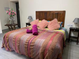 Posteľ alebo postele v izbe v ubytovaní Hotel Rural Molino del Puente Ronda