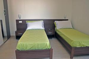 Een bed of bedden in een kamer bij Villa Lara