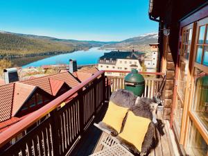 a balcony with a view of a body of water at Åre Travel - Tottvillan in Åre