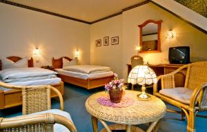 Postel nebo postele na pokoji v ubytování Hotel Am Grudenberg