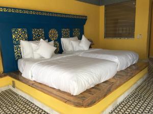 A bed or beds in a room at Phong Nha Farmstay 
