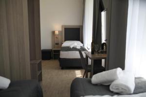Postel nebo postele na pokoji v ubytování Hotel CK Park