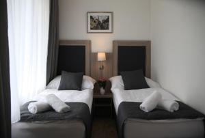 Postel nebo postele na pokoji v ubytování Hotel CK Park