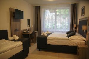 Postel nebo postele na pokoji v ubytování Hotel CK Park