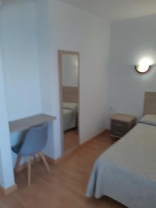 Postel nebo postele na pokoji v ubytování Hotel Condestable