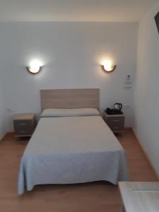 Postel nebo postele na pokoji v ubytování Hotel Condestable