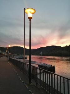a street light next to a body of water at Pension Pauly in Boppard