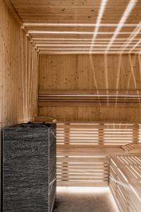an empty sauna with wooden walls and ceilings at Aries Hotel & SPA Wisła in Wisła
