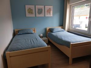 Postel nebo postele na pokoji v ubytování Dolce Vita Gerolstein -Dani