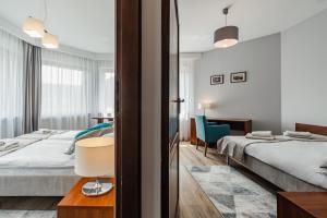 Posteľ alebo postele v izbe v ubytovaní Hotel Smile Pieniny
