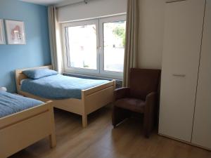 Postel nebo postele na pokoji v ubytování Dolce Vita Gerolstein -Dani