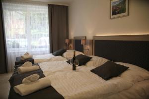 Postel nebo postele na pokoji v ubytování Hotel CK Park