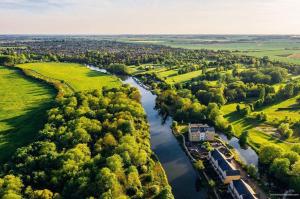 an aerial view of a river with trees at Rivermeadow View Apartment -27 Skipper Way in Saint Neots