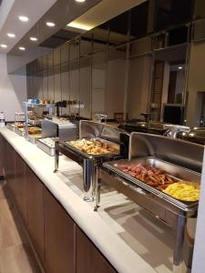 a buffet line with many different types of food at Hotel Union in Podgorica