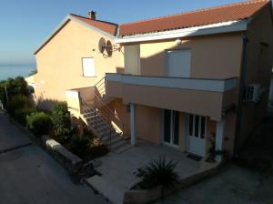 an overhead view of a house with a balcony at Apartmans and rooms ''Slavica'' in Novalja