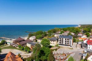 an aerial view of a town next to the ocean at Morska 5 in Niechorze