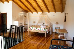 En eller flere senge i et værelse på Quinta David