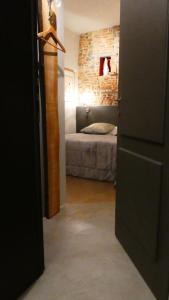 Postel nebo postele na pokoji v ubytování LO studiO B&B