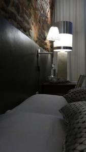 Postel nebo postele na pokoji v ubytování LO studiO B&B