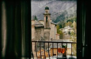 a view from a window of a building with a tower at Auberge Saint Martin in La Brigue