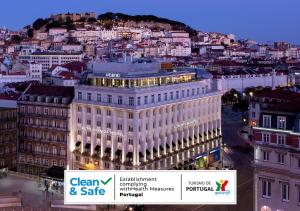 a large white building with a city in the background at Altis Avenida Hotel in Lisbon