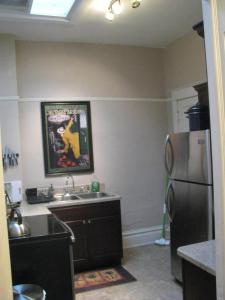 a kitchen with a refrigerator and a sink at The Westland Suite in Chester +6 photos