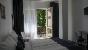 Postel nebo postele na pokoji v ubytování Hotel Metropol CB