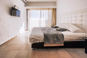 Postel nebo postele na pokoji v ubytování Hotel Blue Weiss