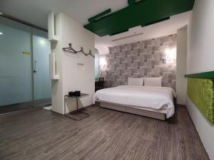 Postel nebo postele na pokoji v ubytování Walker Hotel - Zhengyi