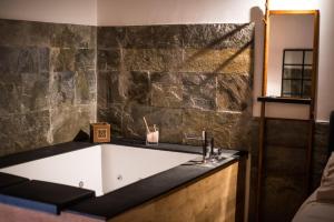 a bathroom with a sink and a mirror at Corte Capomazza Appartamenti in Naples