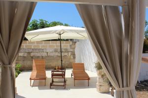 A patio or other outdoor area at Trullo Le Macchie