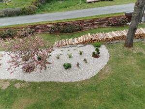 an overhead view of a garden with flowers and plants at Apartmány Dolní Moravice in Dolní Moravice