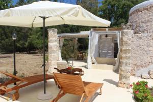 A patio or other outdoor area at Trullo Le Macchie