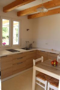 A kitchen or kitchenette at Trullo Le Macchie