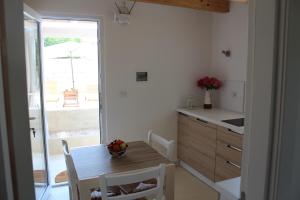 A kitchen or kitchenette at Trullo Le Macchie