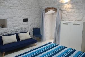 A bed or beds in a room at Trullo Le Macchie
